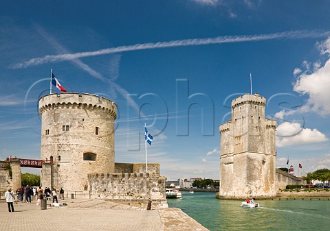 The towers of La Chaine and St Nicholas at the entrance to the ancient port of La Rochelle CharenteMaritime France