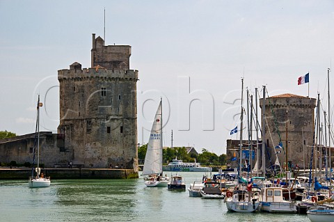 The towers of St Nicholas and La Chaine at the entrance to the ancient port of La Rochelle CharenteMaritime France