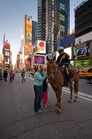 Policeman on horse patrol Times Square New York New York USA