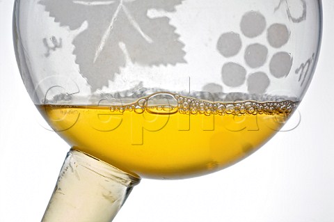 Sample of white wine in a glass pipette