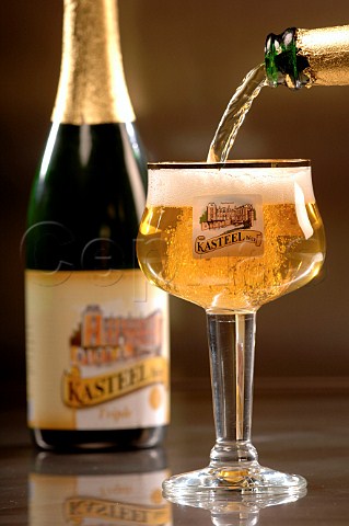Pouring glass of Kasteel bier Belgian beer