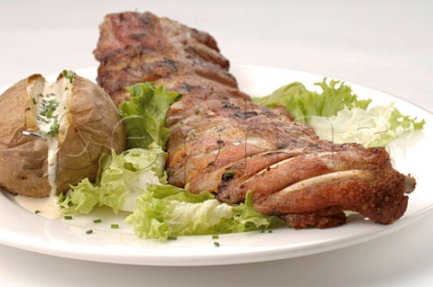 Roast loin of pork with baked potato