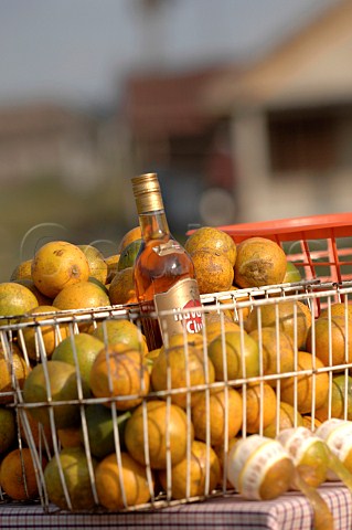 Bottle of Havana Club Rum in shopping basket of oranges  Havana market Cuba