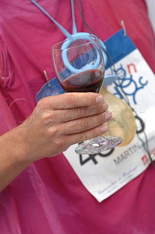 Runner with glass of wine at Chteau PontetCanet refreshment station during the Marathon du Mdoc Pauillac Gironde France  Pauillac  Bordeaux