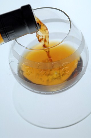 Pouring glass of Martell Cognac