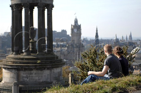 Young couple by the The Dugald Stewart Monument on Calton Hill Edinburgh Scotland