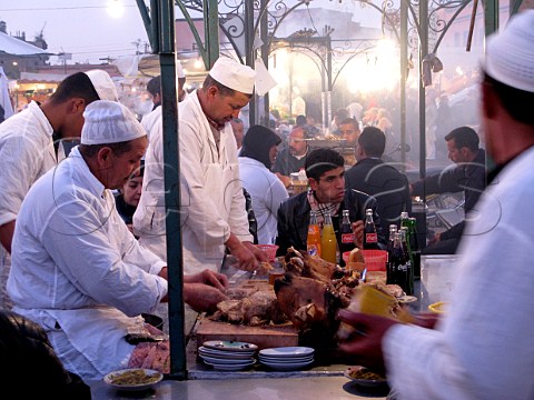 Cooking lamb in Marrakech souk Morocco