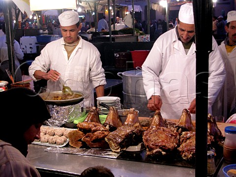 Marinating lamb on a caf stall Marrakech souk Morocco