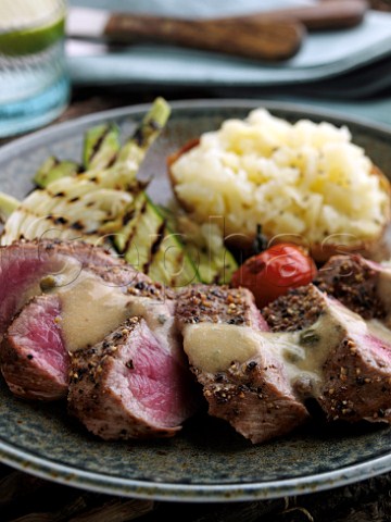 Lamb loin with a baked potato and celeriac