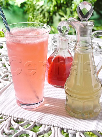 A glass of sparkling raspberry soda