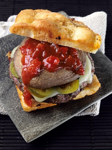 Beef burger with creole sauce and foccacia bread roll