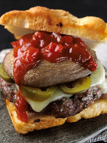 Beef burger with creole sauce and foccacia bread roll