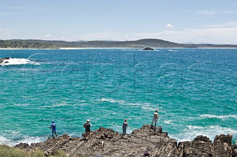 Fishermen on rocks at Mullimburra Point Eurobodalla NP New South Wales Australia