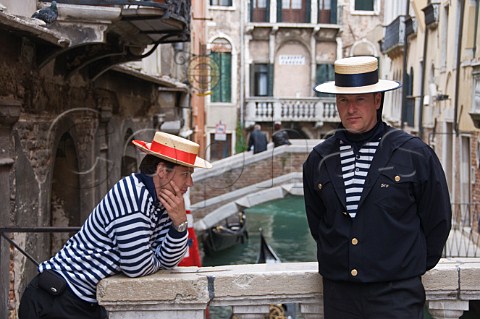Gondoliers waiting for custom San Marco Venice Italy