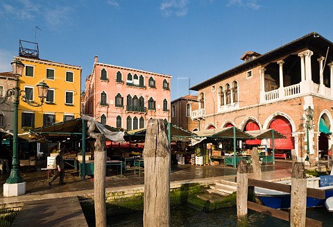 Openair fruit and vegetable stalls next to the Grand Canal Rialto market San Polo Venice Italy