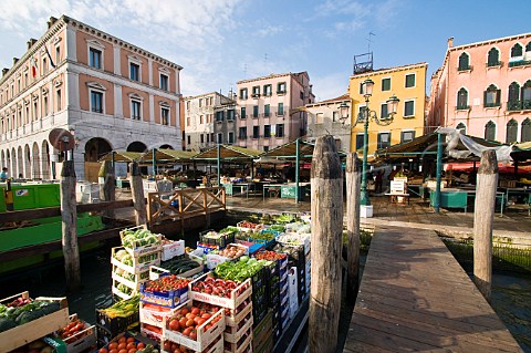 Fruit and vegetables arriving by boat on the Grand Canal for Rialto market San Polo Venice Italy