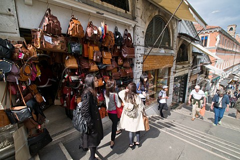 Souvenier shops on the stepped street over Rialto Bridge San Polo Venice Italy
