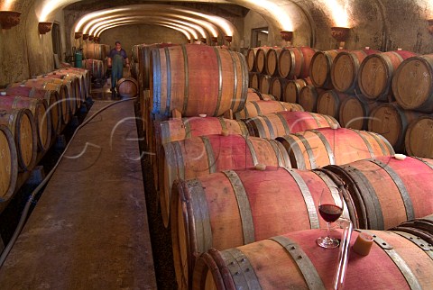 Glass of red wine and pipette on barrel in cellar of Adelsheim Winery  Newberg Oregon USA  Willamette Valley