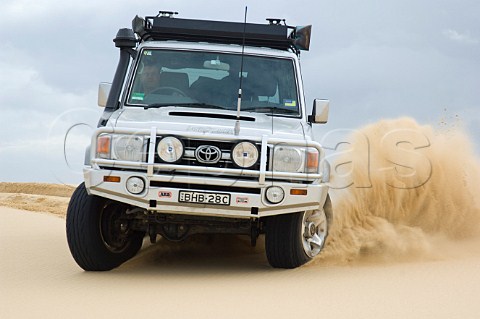 Toyota Landcruiser on sand dune at Stockton Beach Newcastle New South Wales Australia