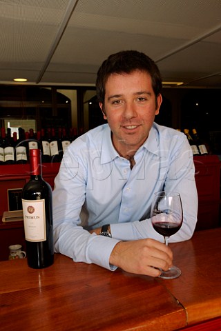 Cristian Aliaga head winemaker of Veramonte with a bottle of his Primus  Casablanca Valley Chile