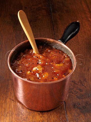 Copper saucepan of mango chutney