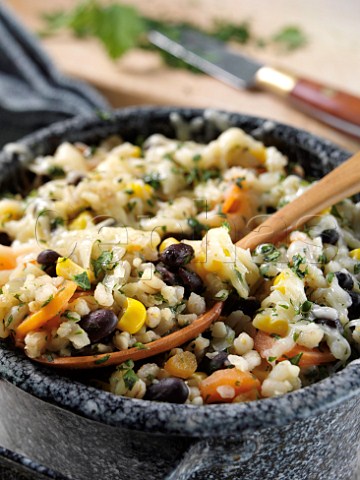 Vegetarian casserole with pearl barley bulgar wheat black beans carrots and corn