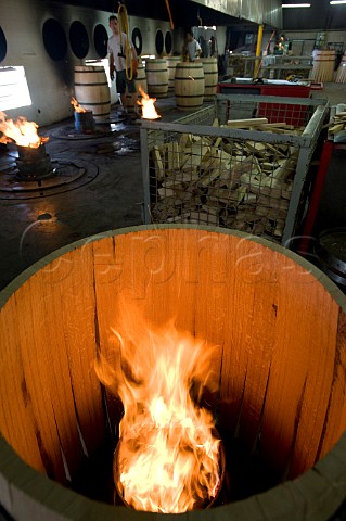 Toasting an Essencia barrique in the cooperage of Demptos from their socalled Intelligent range of barrels  Bordeaux Gironde France