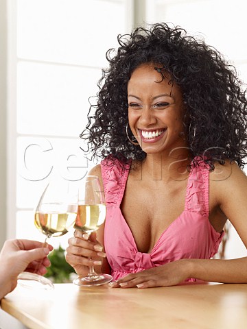 Young woman drinking glass of ros wine