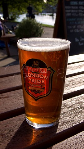 Pint of London Pride in the beer garden of the Weir pub WaltononThames Surrey England