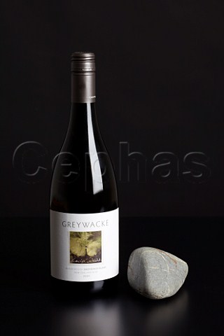 Bottle of Greywacke Sauvignon Blanc 2009 with Greywacke rock from the vineyard  Marlborough New Zealand
