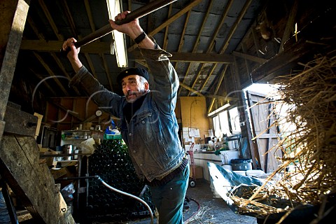 Dr Hugh Tripp applying pressure to a cider press  Pennard Organic Cider and Wine Avalon Orchard East Pennard Somerset England