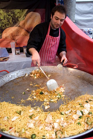 Man selling stirfried vegetable noodles at the York International MarketPlace York England