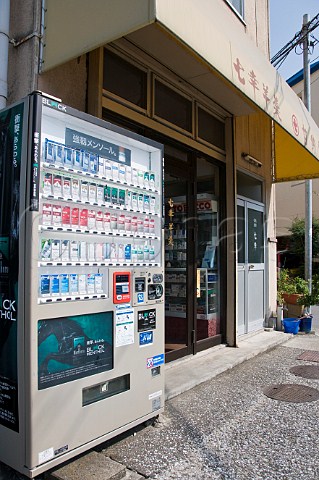 Cigarette vending machine outside a small tobacconist shop  Oita Kyushu Japan