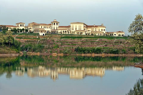Junding winery reflected in lake near Penglai Shandong Province China