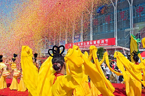 Confetti showering dancers during opening ceremonies at the Yantai Wine Festival Yantai Shandong Province China