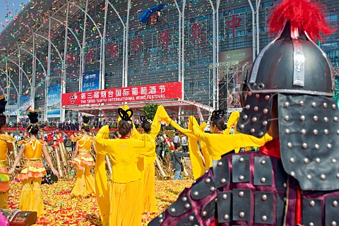 Dancers showered with confetti during opening ceremonies at the Yantai Wine Festival Yantai Shandong Province China
