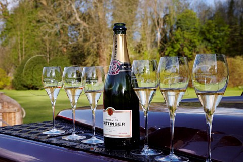 Glasses of Champagne on the bonnet of a Land Rover to drink prior to launching of the Taittinger hotair balloon