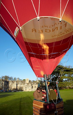 Launching the Taittinger hotair balloon in the grounds of Bibury Court Hotel Gloucestershire England