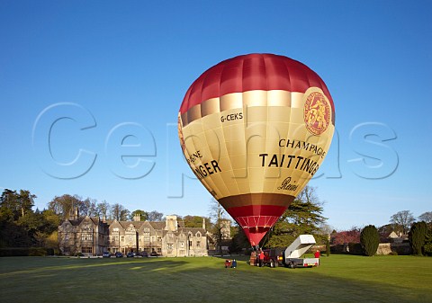 Launching the Taittinger hotair balloon in the grounds of Bibury Court Hotel Gloucestershire England