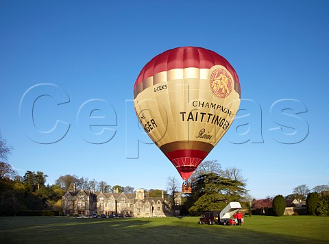 Launching the Taittinger hotair balloon in the grounds of Bibury Court Hotel Gloucestershire England