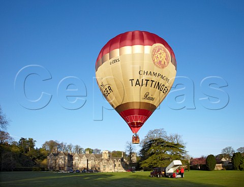 Launching the Taittinger hotair balloon in the grounds of Bibury Court Hotel Gloucestershire England