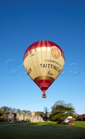 Launching the Taittinger hotair balloon in the grounds of Bibury Court Hotel Gloucestershire England