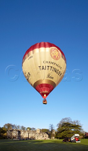 Launching the Taittinger hotair balloon in the grounds of Bibury Court Hotel Gloucestershire England