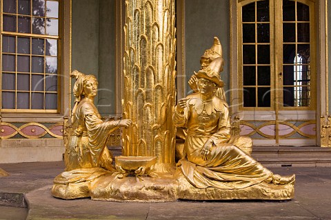 Gilded statues in the Chinese teahouse Sanssouci gardens Berlin Germany