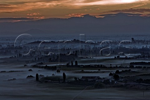 Early morning mist near San Javier in the Maule Valley with dawn breaking over the Andes mountains Chile