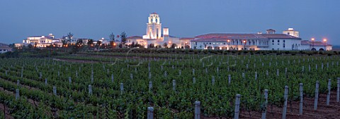 Evening view of vineyard and illuminated Chateau Junding winery near Penglai Shandong Province China