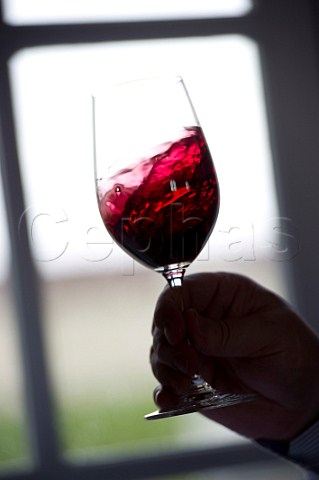 Swirling wine in glass En Primeur tasting of the 2009 vintage at Chteau Marquis de Terme  Margaux Bordeaux France