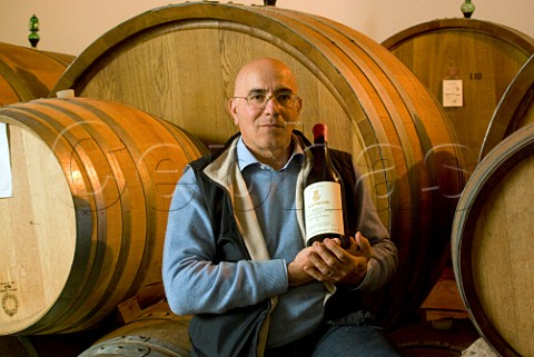 Aldo Vajra with bottle of his Bricco Delle Viole 2001 in the cellars of GD Vajra Barolo Piemonte Italy  Barolo