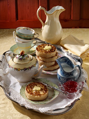Buttered crumpets in an afternoon tea setting