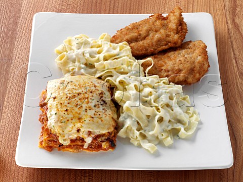 Fried battered chicken breasts lasagna and tagliatelli